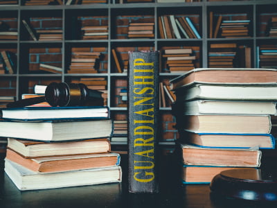 Photo of a law library with a book about Guardianships