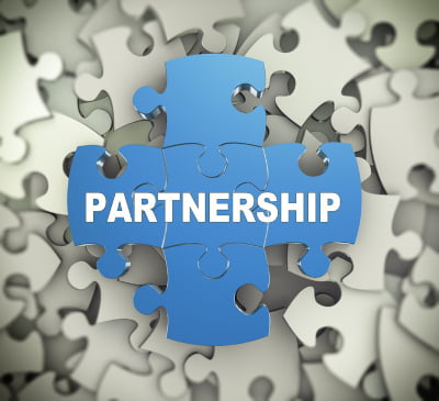 Jigsaw with the word Partnership printed on it signifying partnership agreements